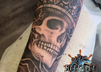 skull cover up tattoo